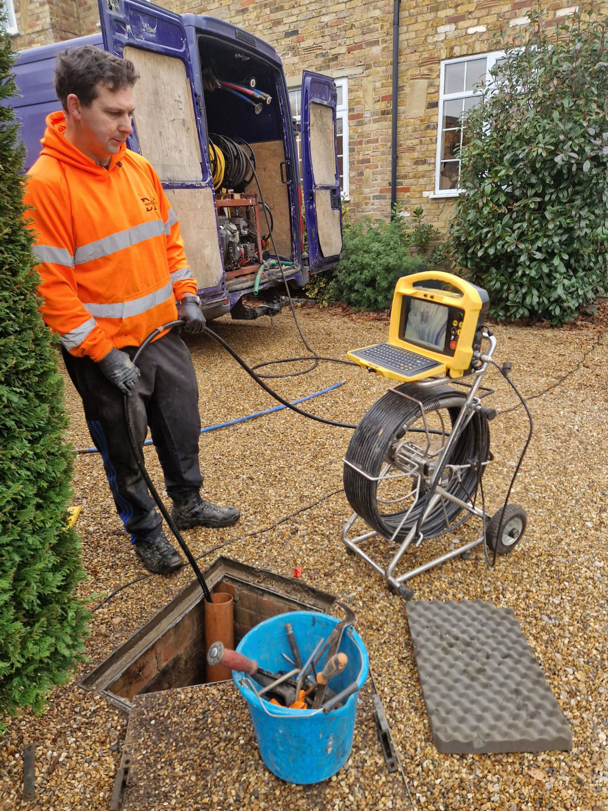 CCTV drain inspection showing tree roots entering a cracked drain pipe in Cobham
