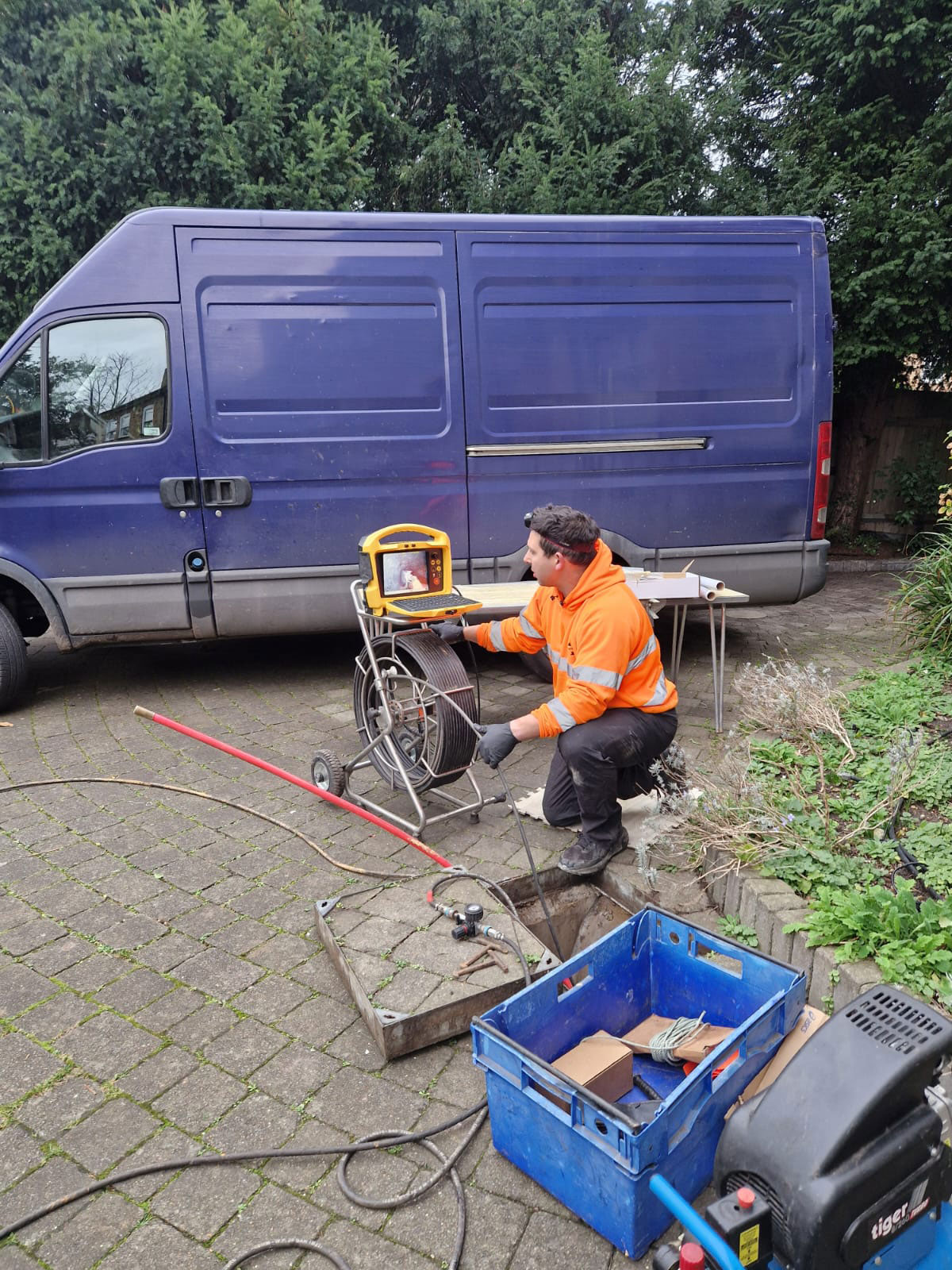 Declan from Drain Ace installing a radial patch liner to repair a leaking rest bend in a drain in Epsom